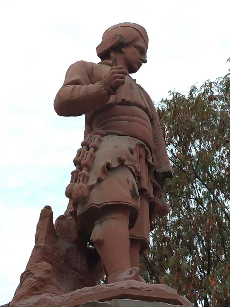 Copper statue of Juan Godoy holding a miner's tools in the centre of Copiapo. 